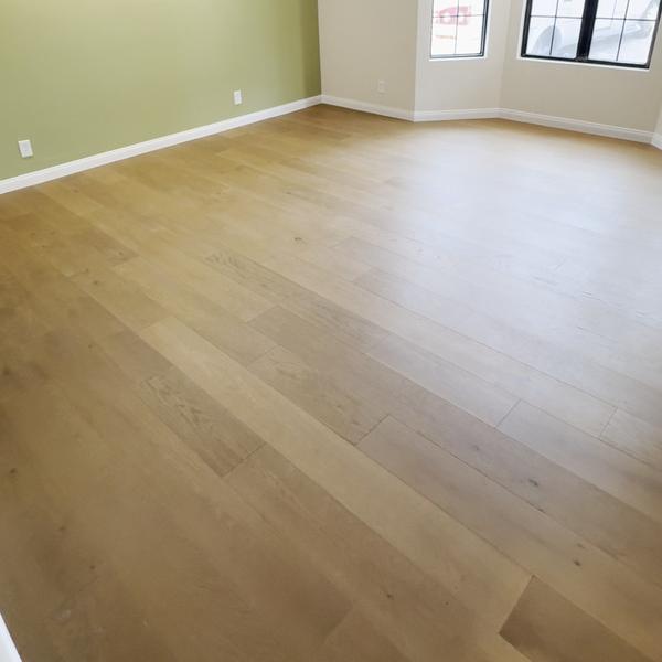 Engineered hardwood in a room with a bay window