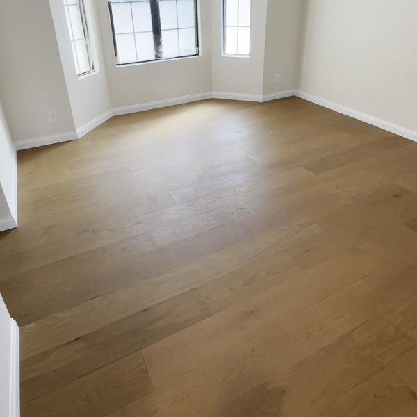 Engineered hardwood in a bright room with windows