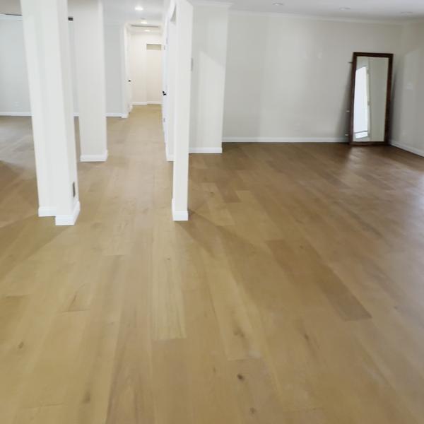 Engineered hardwood down an open hallway