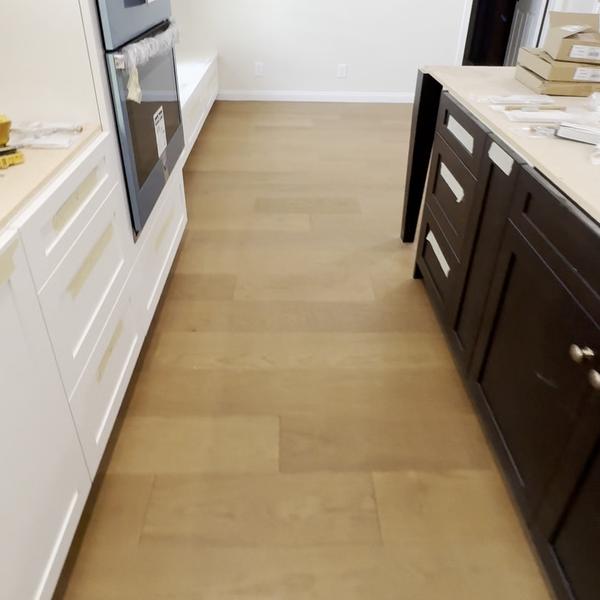 Engineered hardwood along kitchen cabinets
