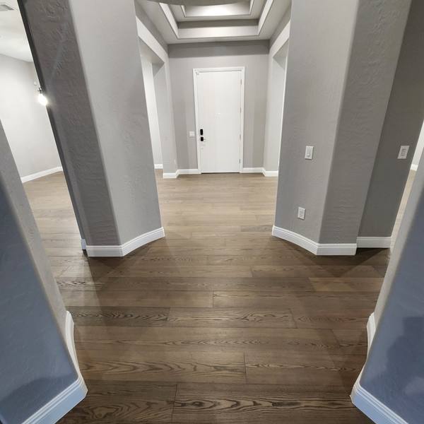 Engineered hardwood at an arched entry