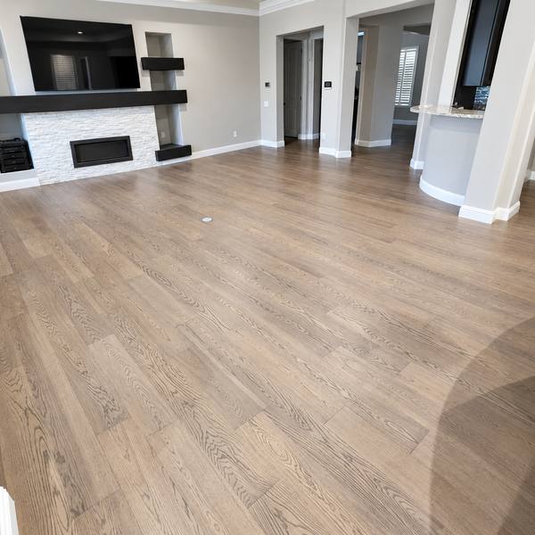 Engineered hardwood in a family room with a fireplace