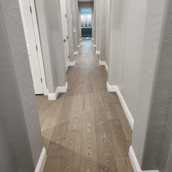 Engineered hardwood down a long hallway