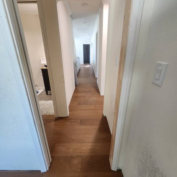 Plank flooring down a hallway