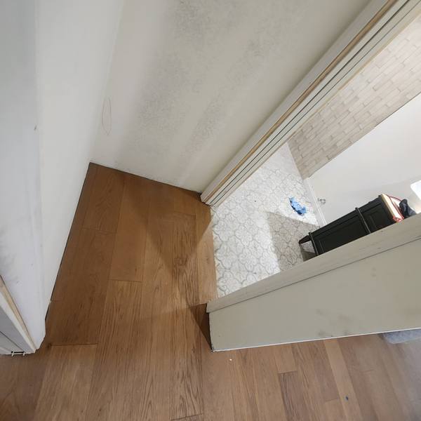 Plank flooring meeting bathroom tile