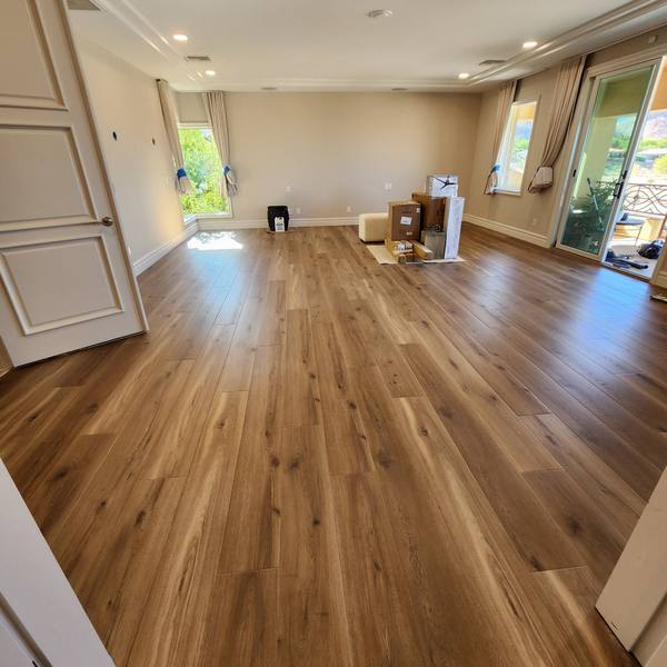 Plank flooring in a primary bedroom