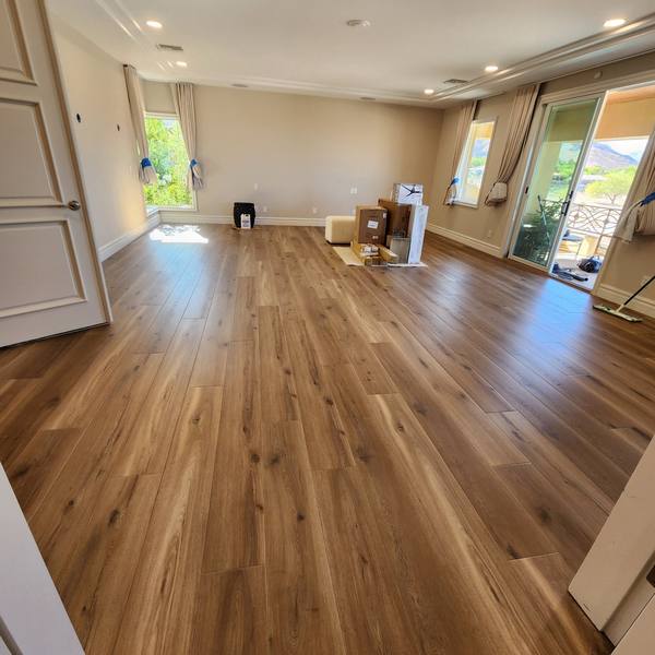 Plank flooring across a large bedroom