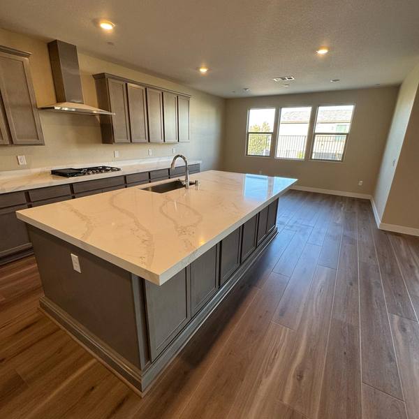 Plank flooring around a kitchen island