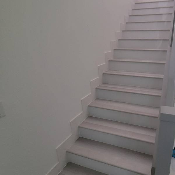 Stairs with light gray treads and white risers
