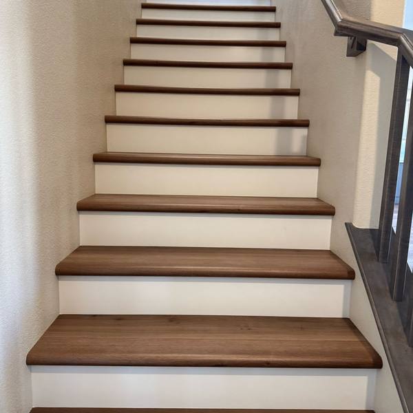 Stairs with wood-tone treads and white risers