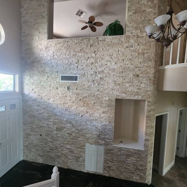 Stacked-stone wall with niches