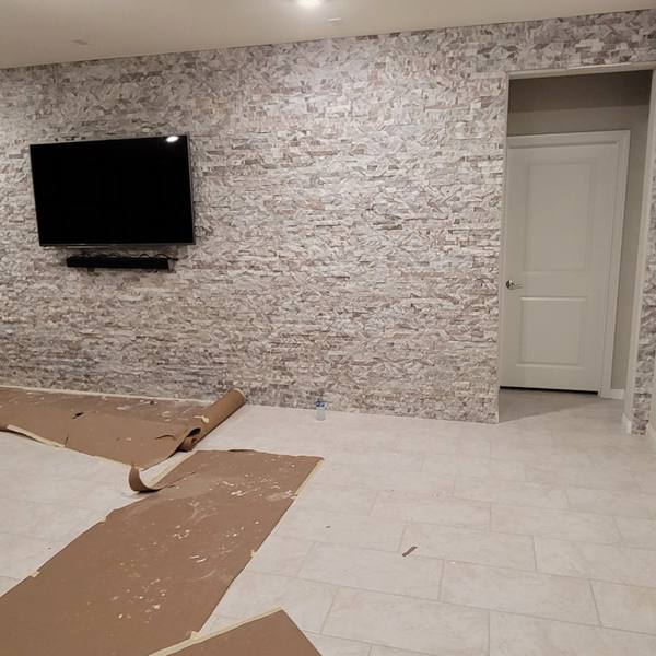 Stacked-stone wall around a TV