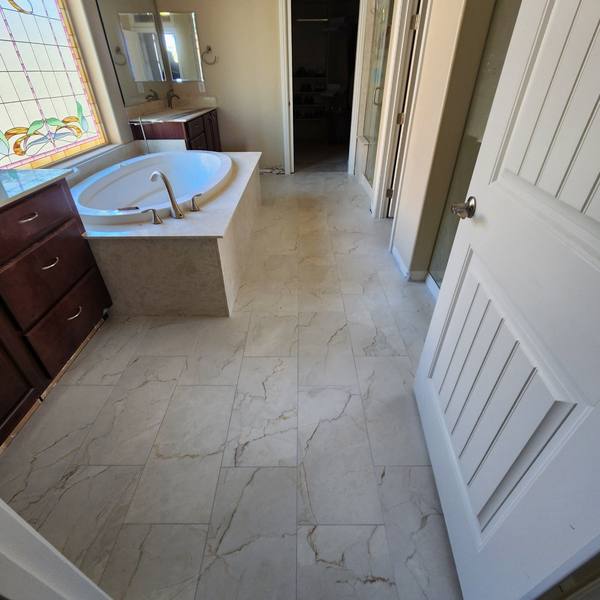 Tile floor in a primary bathroom