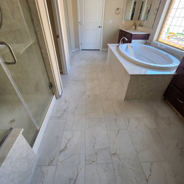 Tile floor in a bathroom with a soaking tub