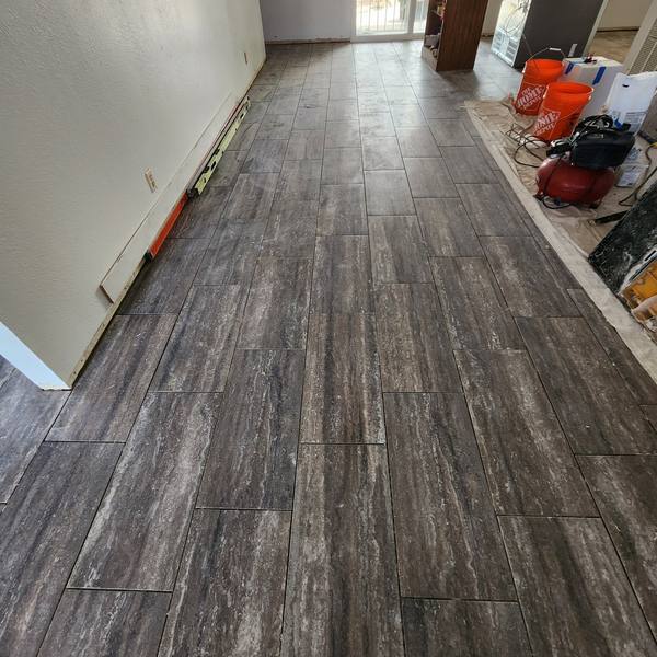 Dark veined tile laid in a staggered pattern