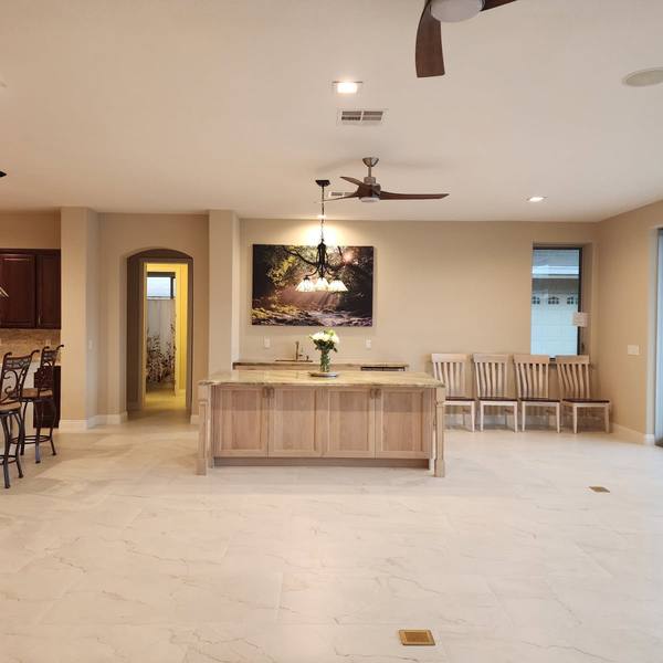 Tile floor through a kitchen and dining area