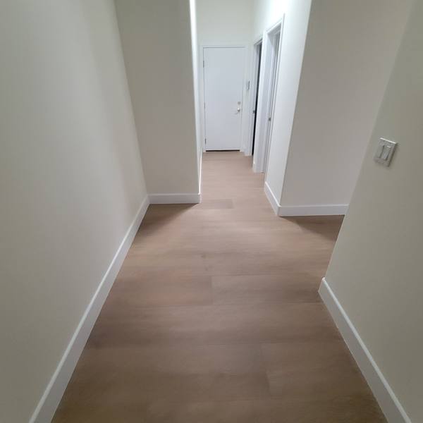 12x72 wood-look tile down a hallway