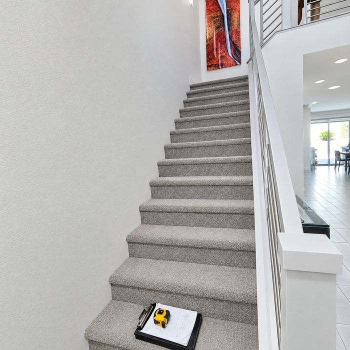 Carpeted staircase measured for new treads