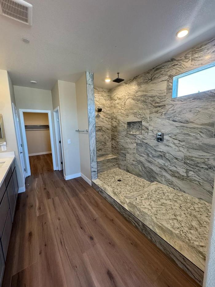 Primary bathroom with the finished walk-in shower