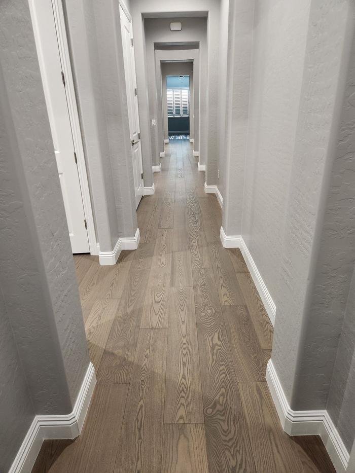 Finished engineered hardwood in the main hallway