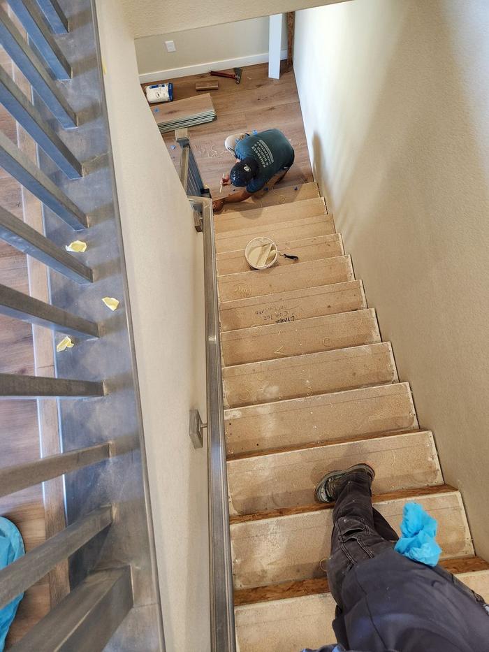 Staircase stripped to bare steps before new treads